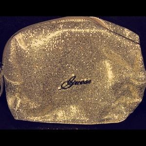 gold glitter Guess makeup bag